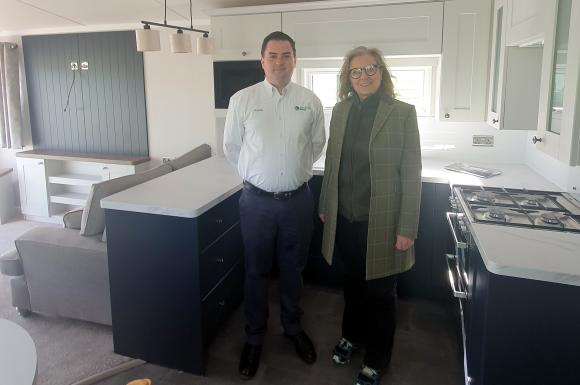 Frank Maguire shows MSP Rachael Hamilton one of his park's holiday home interiors