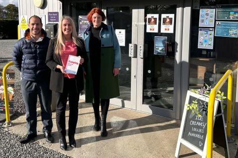 Angie Purves displays one of the park's recent awards with WCF's Daniel Sowerby and Jo Ritzema